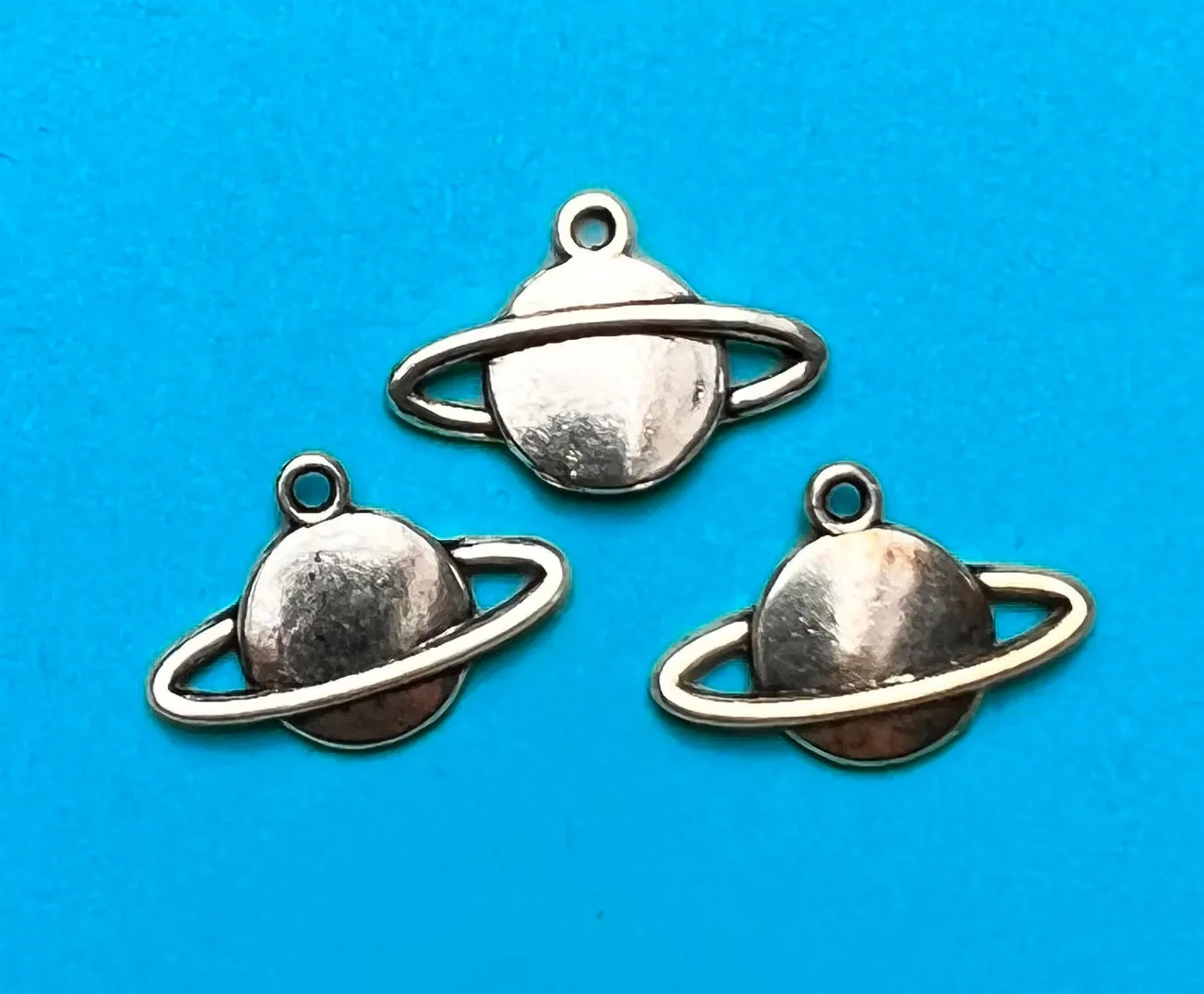 3 Perfect Little Planet Charms - 2.2cm wide.