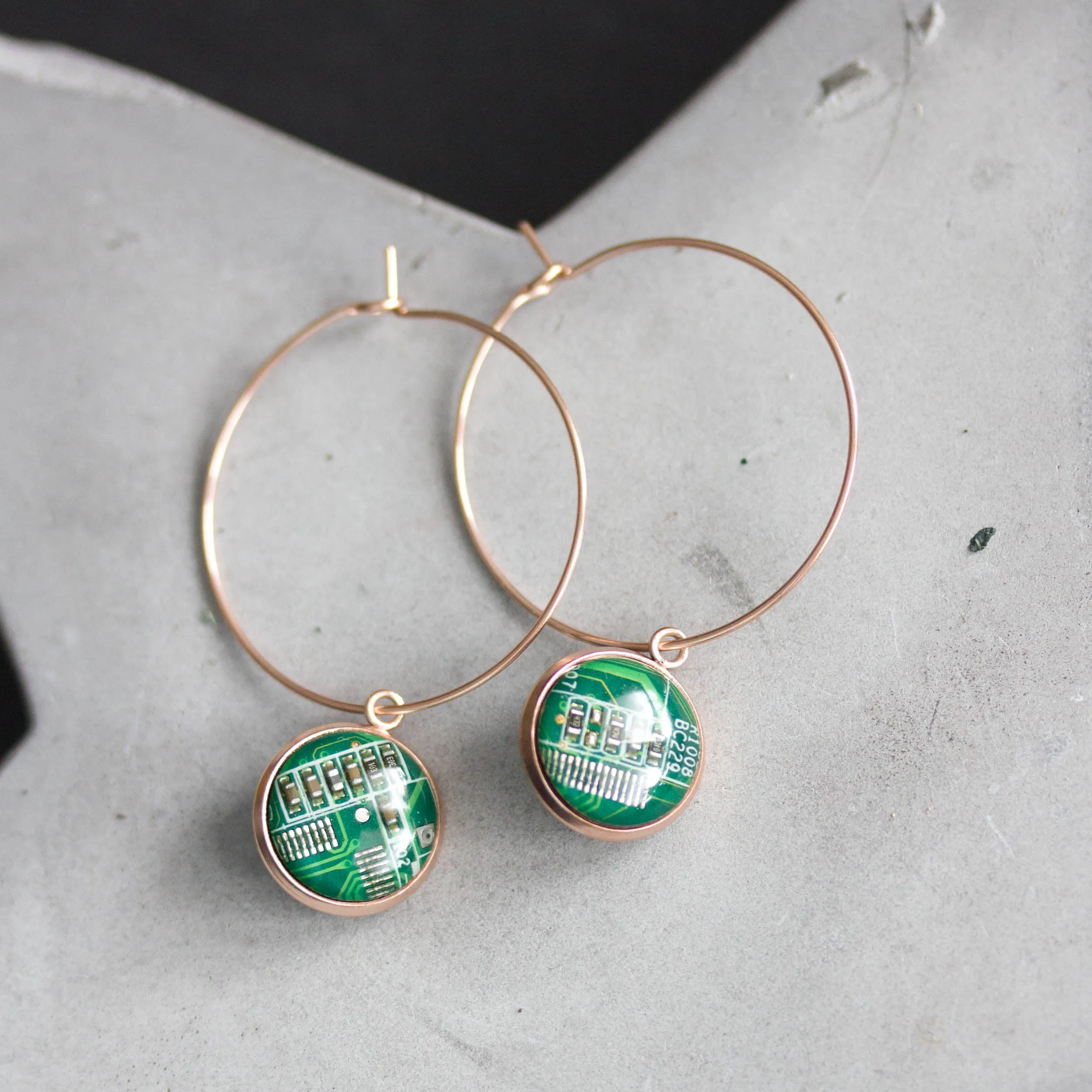 Hoop earrings with 12mm round circuit board pendants, rose gold colored wires