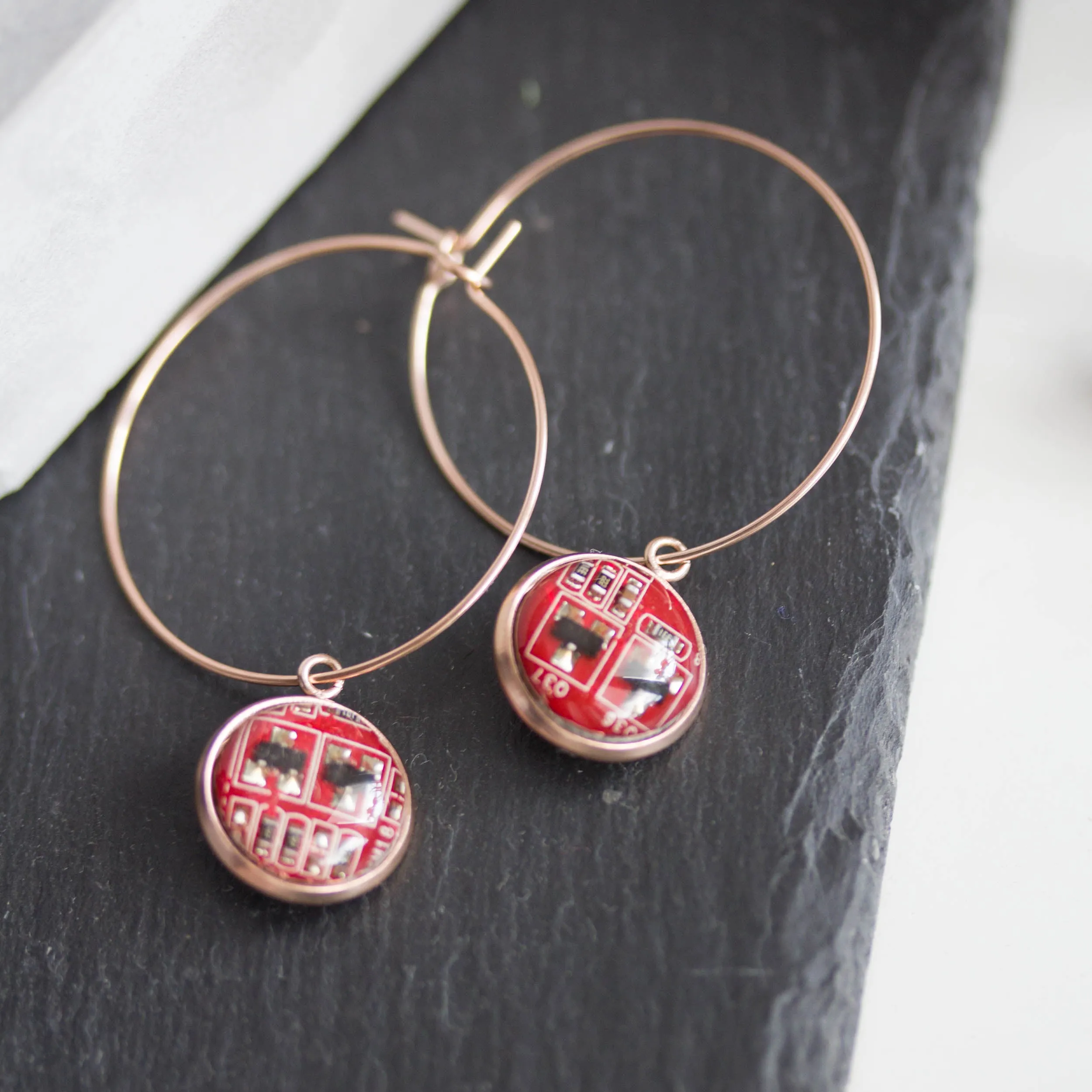 Hoop earrings with 12mm round circuit board pendants, rose gold colored wires